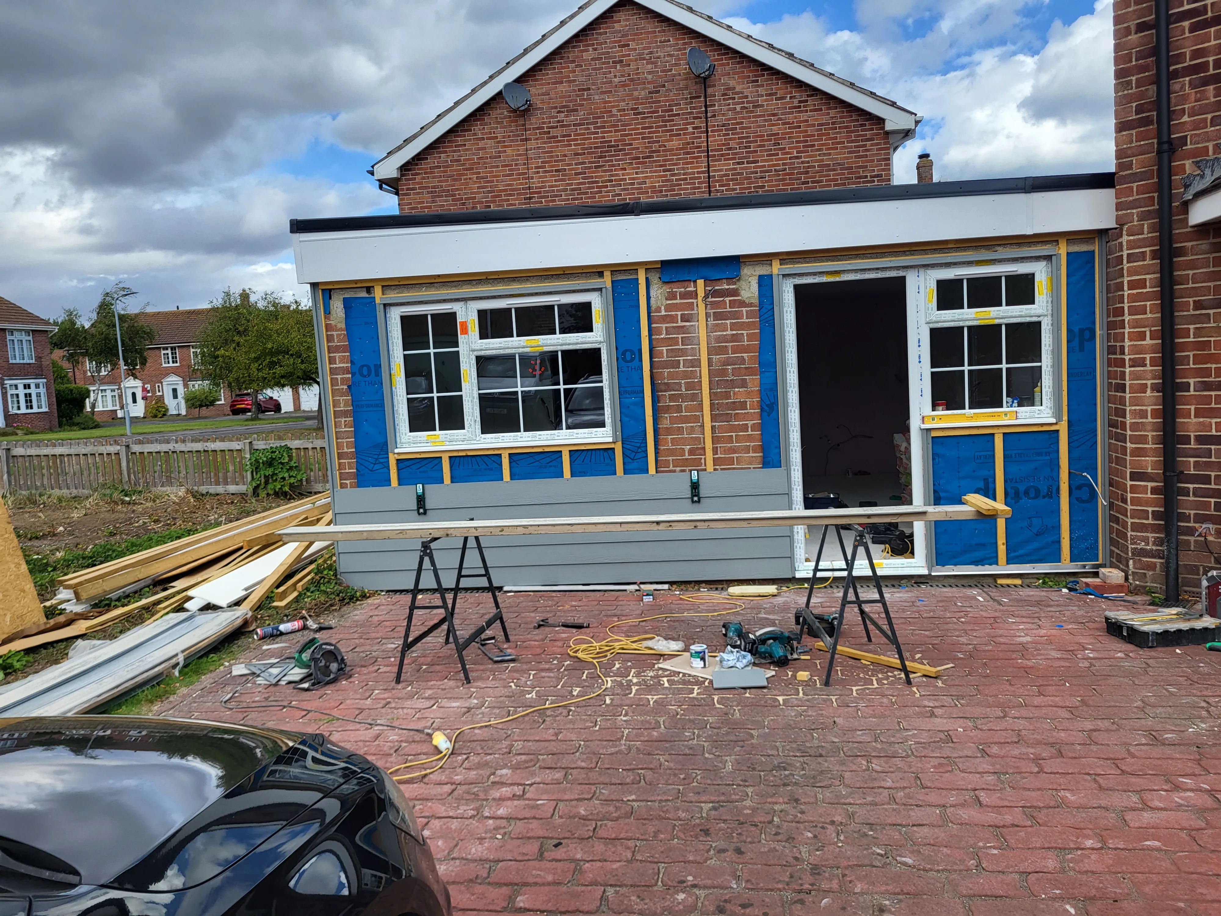 Cladding and window installation on Somerset property